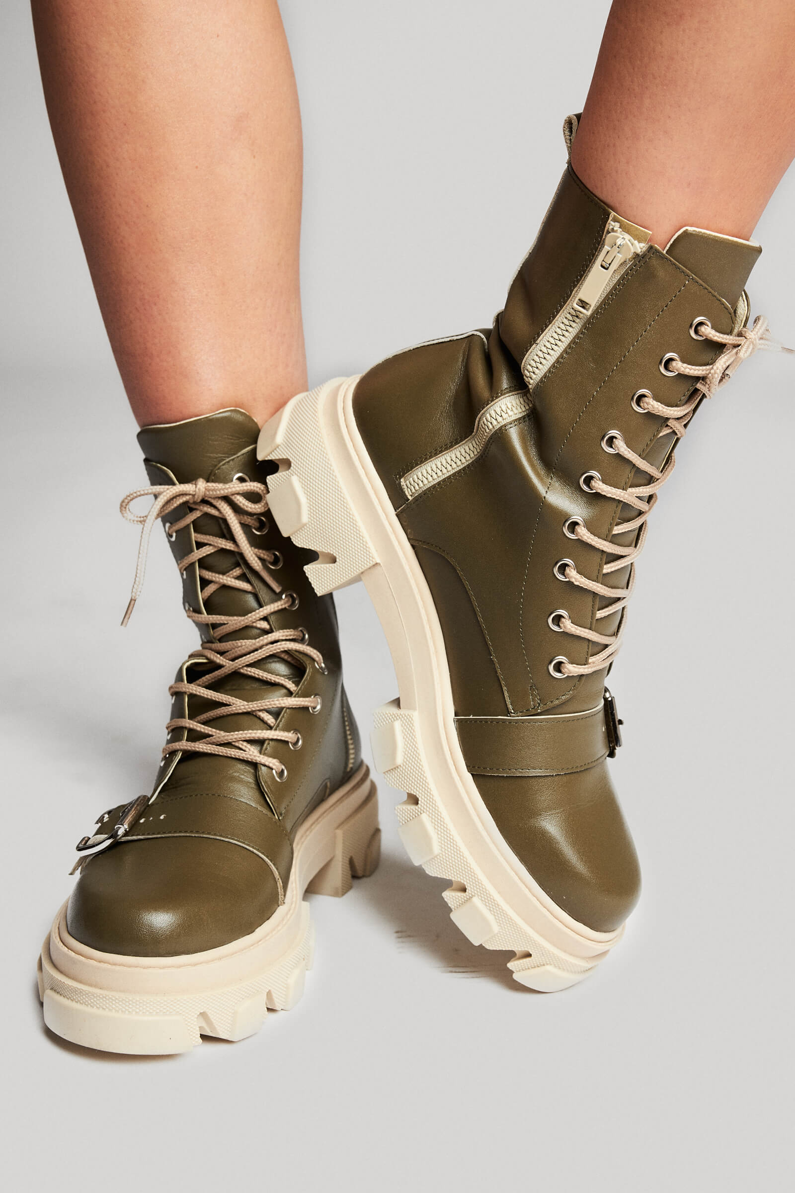 Buckle up, soldier! We're enrolling in the army of well-played outfits! You can never go wrong with a good pair of combat boots and in this olive shade too?! This season olive green is the new black, for sure!