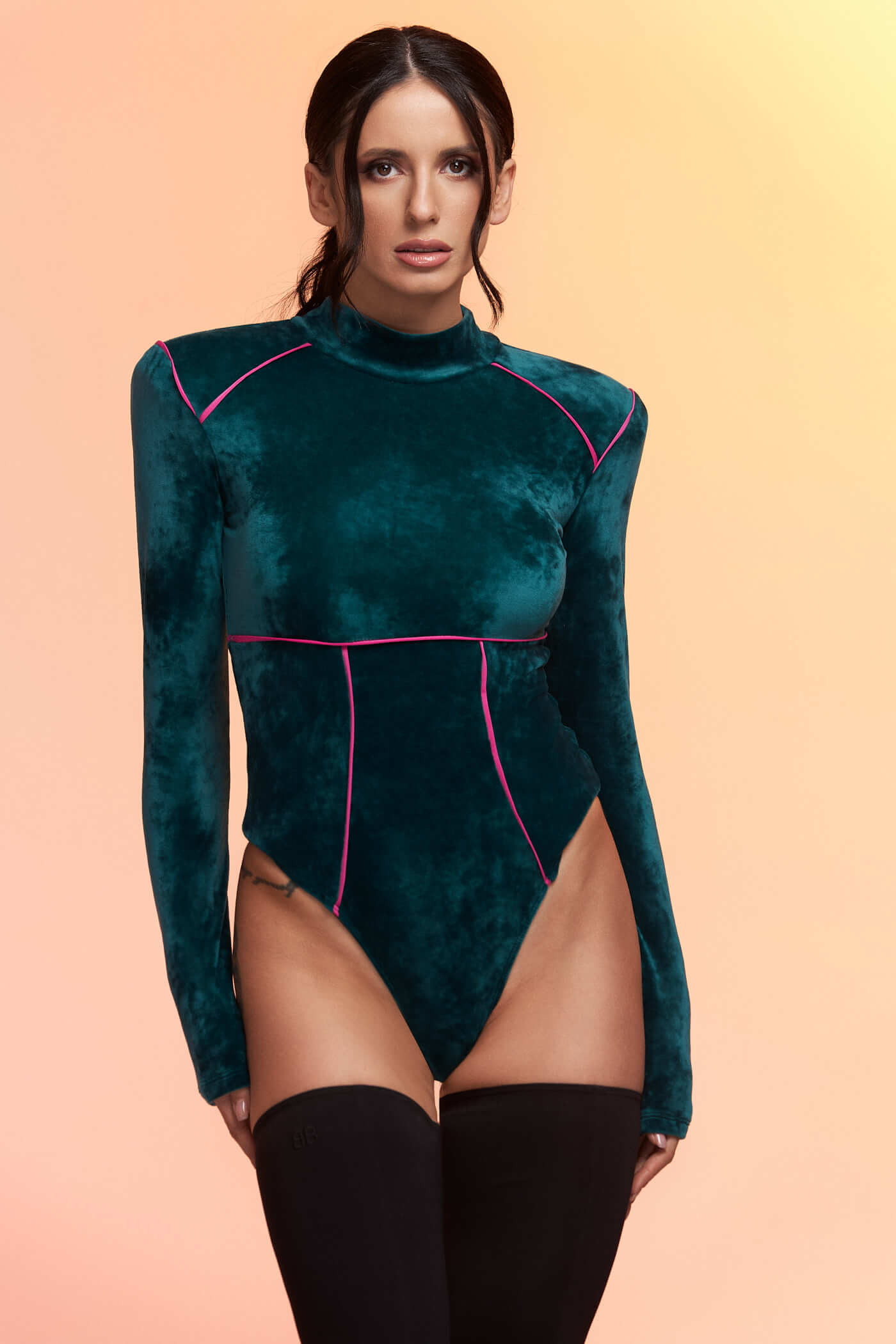 You asked for it so we enhanced it! Our signature long sleeve bodysuit is back and better than ever, it’s bolder and the colorful body-hugging cut is specially created to accentuate your waist. We are just obsessed with power looks and structured silhouettes so we decided to add shoulder pads to the mix for that even bolder look. Our signature velvet now meets a splash of neon, making any outfit a head-turner!